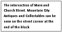 Text Box: The intersection of Main and Church Street. Mountain City Antiques and Collectables can be seen on the street corner at the end of the block
